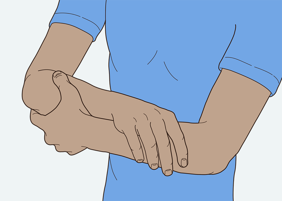 A person touching their arms with their hands.