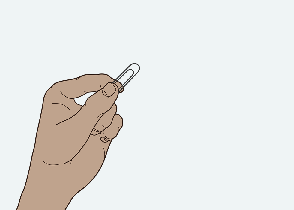 A person holding a paperclip.