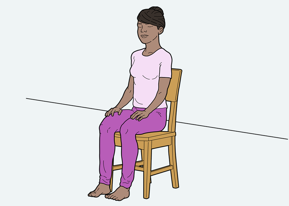 Person sitting in a chair with their eyes and mouth closed.