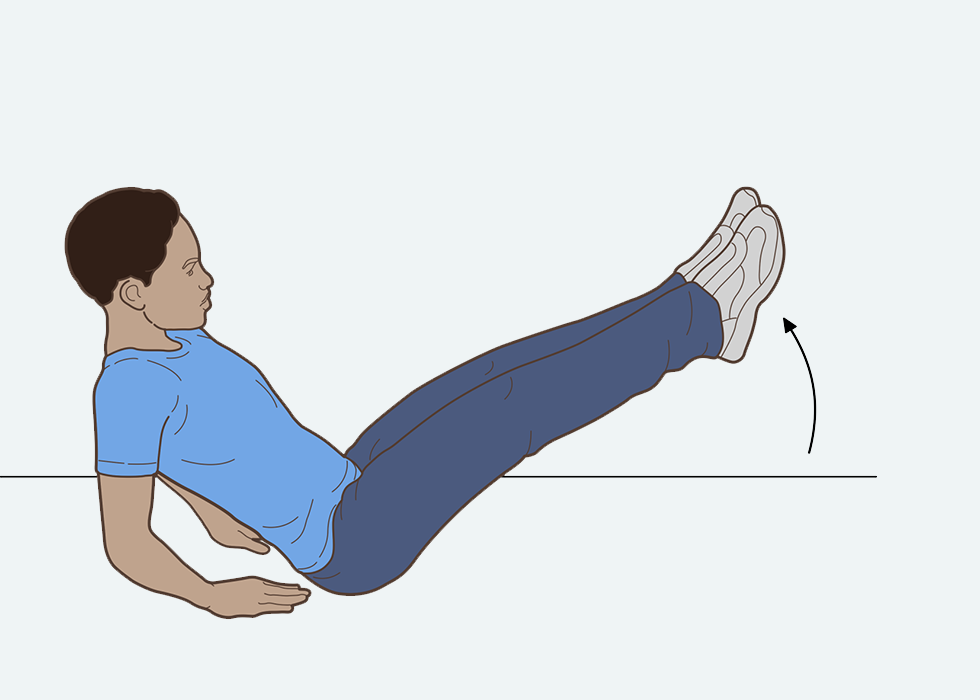 Person sitting on the floor raising their legs into their air
