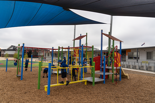 The students are playing in the school's playground